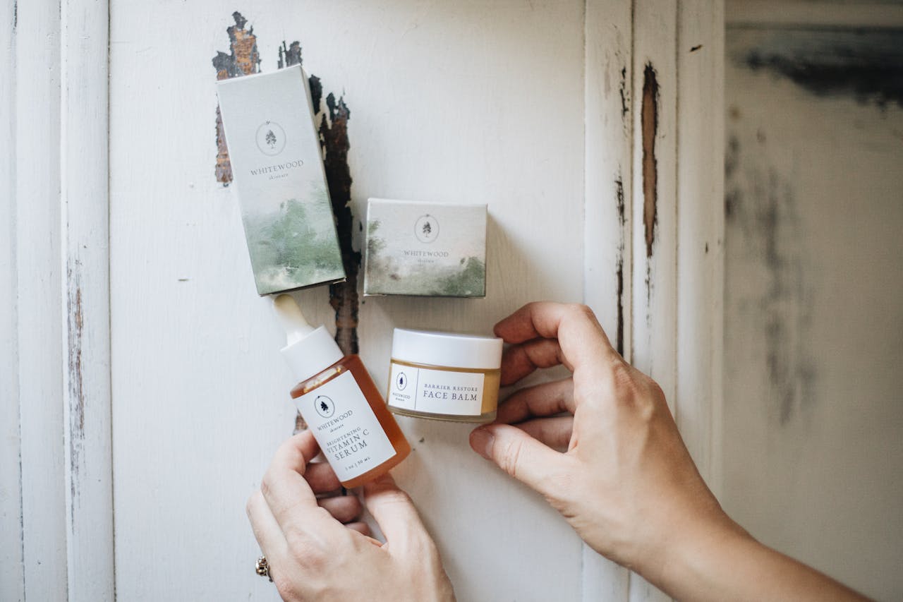 Flat lay of artisanal skincare products on a rustic surface, showcasing natural beauty essentials.